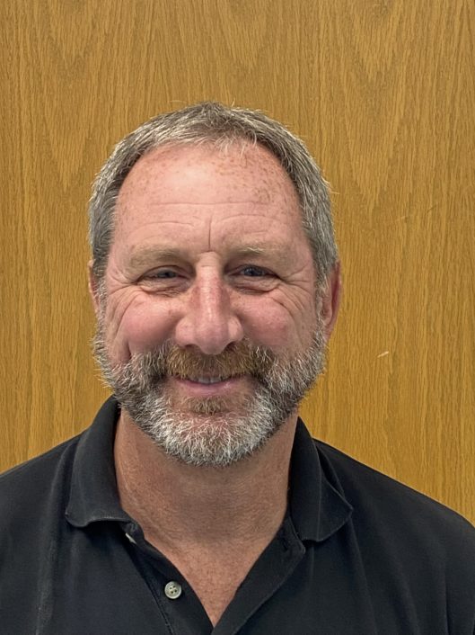 Glen Pedersen, Director of Facilities at McLean School, smiles at the camera