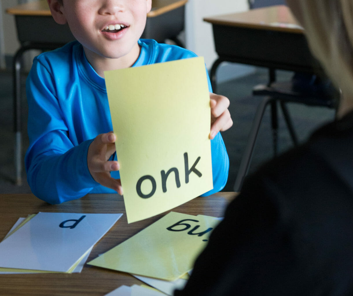 boy using flashcards to help with dyslexia