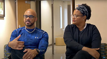 Two parents being interviewed