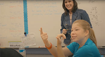 A student counting on her fingers